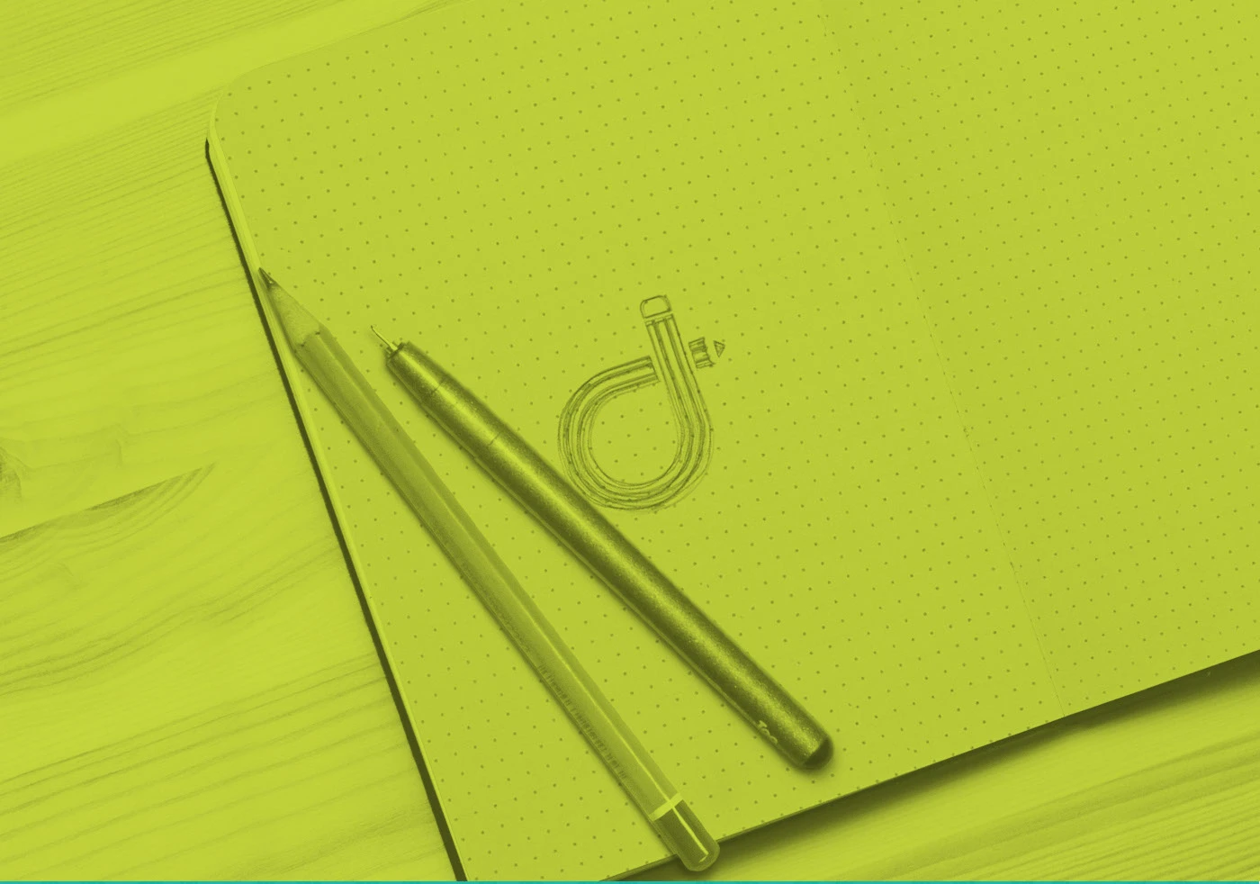 Brand identity on green — notebook mockup